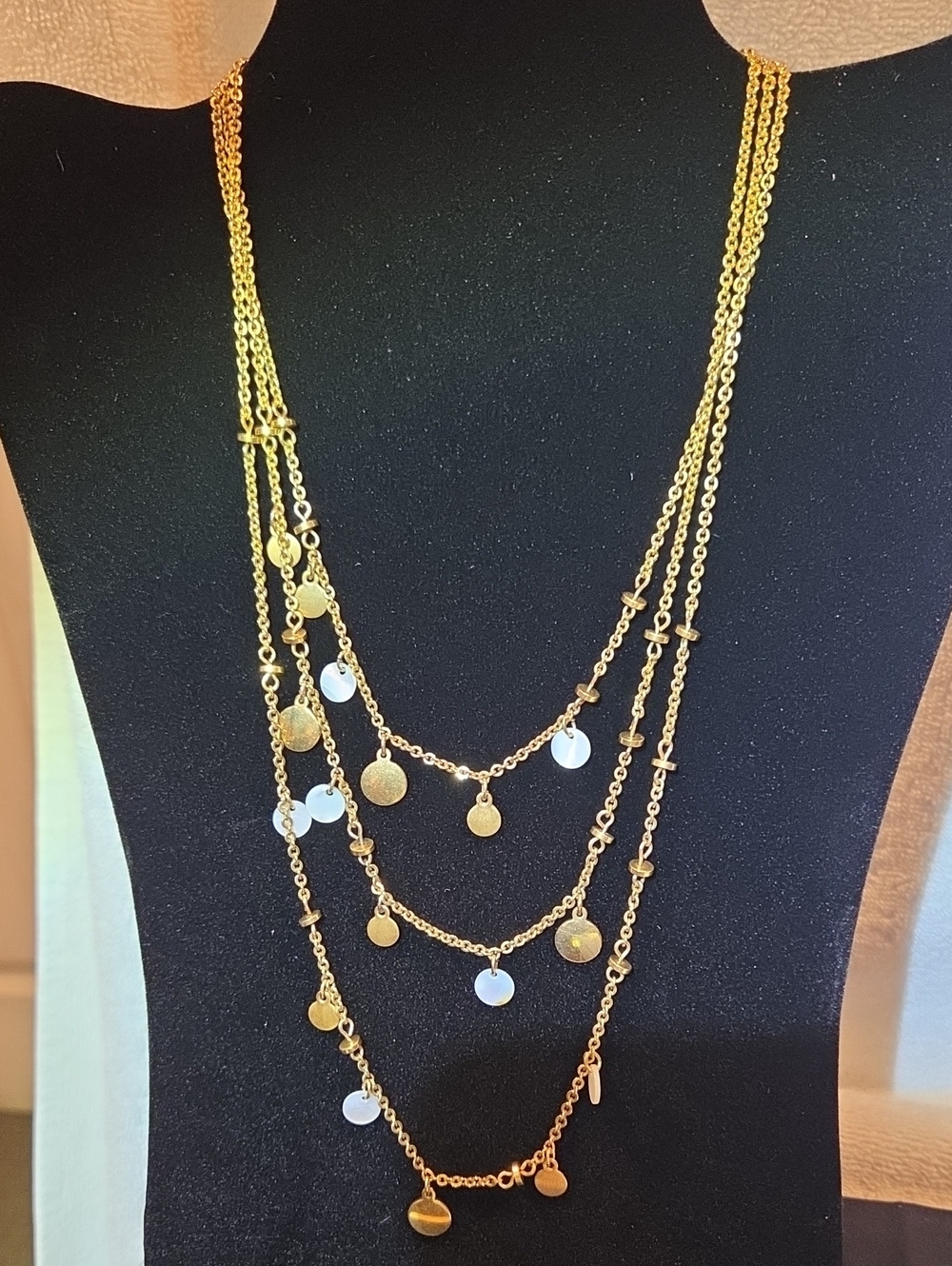 MONET LAYERED MULTI SYRAND NECKLACE WITH MOTHER OF PEARL AND GOLDTONE DISCS